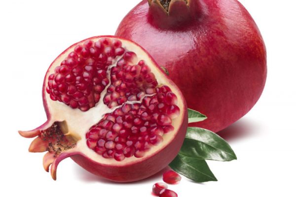 Pomegranate half cut seeds leaves isolated Pomegranate half cut seeds leaves isolated on white background as package design element
