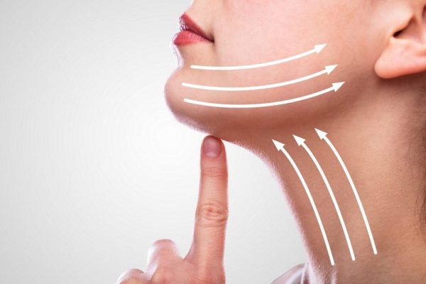 Woman After Face Lifting On Her Face Woman With Arrows On Her Face Over White Background